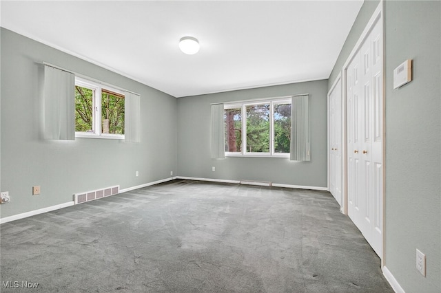 21349 Shelburne, Shaker Heights, OH 44122 - unfurnished bedroom featuring multiple windows and carpet floors