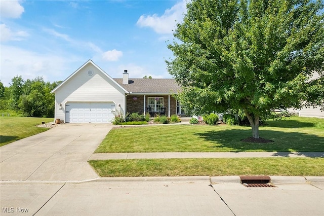 4568 Woodstone Ave NW, Massillon, OH 44647 - view of front of home with a garage, a front yard, concrete driveway, and a chimney