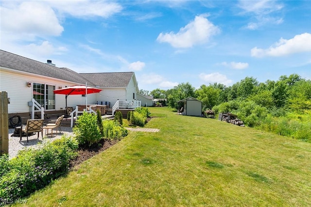 4568 Woodstone Ave NW, Massillon, OH 44647 - view of green lawn with a storage shed and a patio area