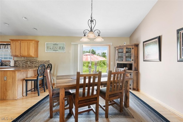 4568 Woodstone Ave NW, Massillon, OH 44647 - dining room featuring light wood-style flooring and healthy amount of natural light