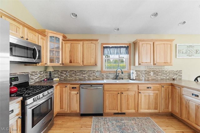 4568 Woodstone Ave NW, Massillon, OH 44647 - kitchen featuring appliances with stainless steel finishes, light brown cabinetry, light wood finished floors, and recessed lighting