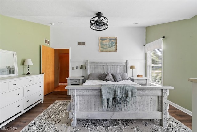 4568 Woodstone Ave NW, Massillon, OH 44647 - bedroom with dark wood-style flooring and high vaulted ceiling