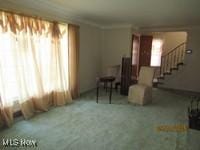 3526 Radcliffe Rd, Cleveland Heights, OH 44121 - sitting room with stairway and carpet