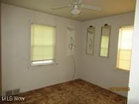 3526 Radcliffe Rd, Cleveland Heights, OH 44121 - spare room with ceiling fan