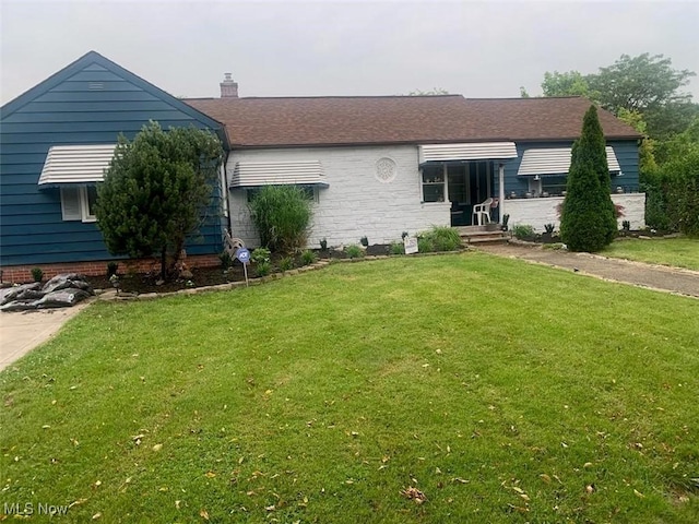 360 Tuxedo Ave, Brooklyn Heights, OH 44131 - view of front of house featuring a front yard and a chimney
