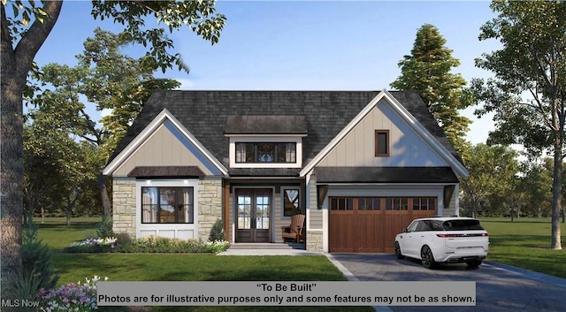 7650 Blackford Dr, Chagrin Falls, OH 44022 - view of front of property with stone siding, asphalt driveway, a front yard, french doors, and a shingled roof