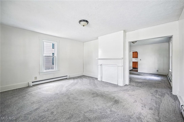 693 W Wilson St, Salem, OH 44460 - empty room with a baseboard radiator, arched walkways, carpet flooring, and a textured ceiling
