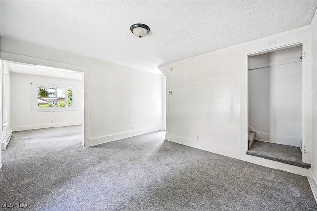 693 W Wilson St, Salem, OH 44460 - unfurnished bedroom featuring a textured ceiling and carpet floors