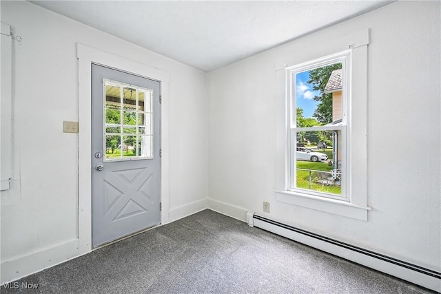 693 W Wilson St, Salem, OH 44460 - entryway with a baseboard radiator, healthy amount of natural light, and dark carpet