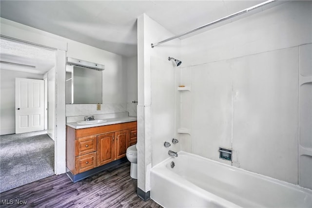 693 W Wilson St, Salem, OH 44460 - full bathroom with washtub / shower combination, vanity, and wood finished floors