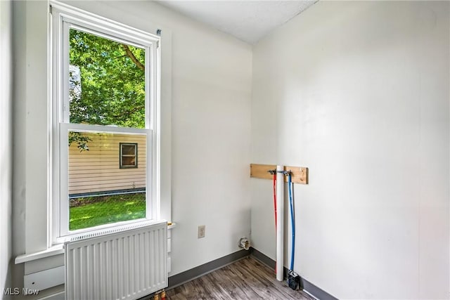693 W Wilson St, Salem, OH 44460 - washroom featuring radiator, healthy amount of natural light, and wood finished floors