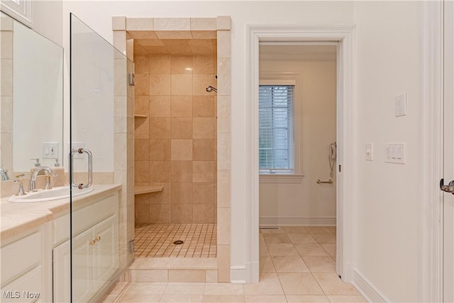 3925 Waterford Ct, Orange, OH 44122 - bathroom with a tile shower, tile patterned flooring, and vanity