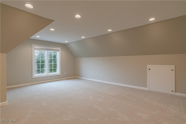 3925 Waterford Ct, Orange, OH 44122 - additional living space with light colored carpet, lofted ceiling, and recessed lighting