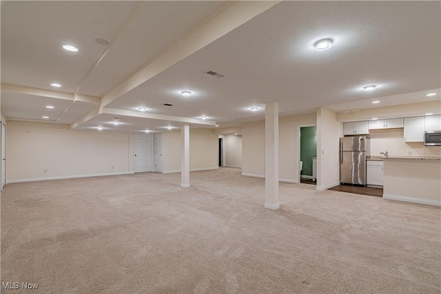 3925 Waterford Ct, Orange, OH 44122 - finished below grade area featuring freestanding refrigerator, light carpet, and recessed lighting