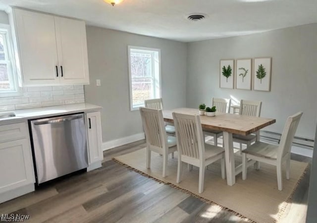 2511 Sherr Ave SE, Canton, OH 44707 - dining area with light wood-style floors and baseboards