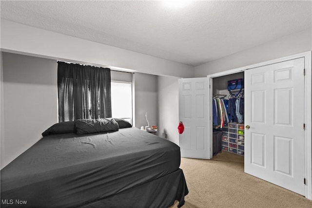 630 E 103rd St, Cleveland, OH 44108 - bedroom with light colored carpet, a closet, and a textured ceiling