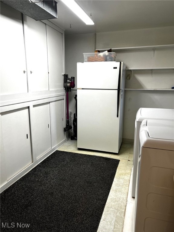8001 Cherry Hl, Warren, OH 44484 - washroom with washing machine and clothes dryer and cabinet space