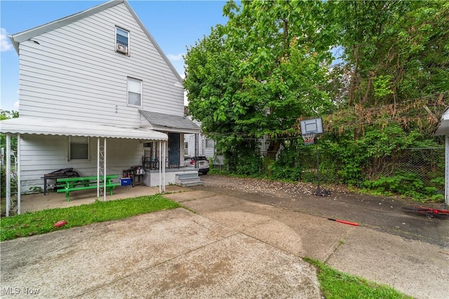 610 E 102nd St, Cleveland, OH 44108 - back of house featuring a patio area