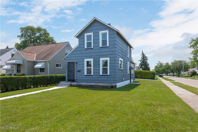 18104 Garden Blvd, Warrensville Heights, OH 44128 - view of front of house with a front lawn