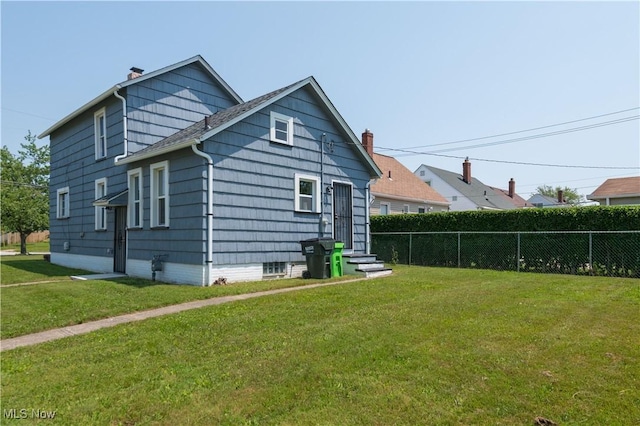 18104 Garden Blvd, Warrensville Heights, OH 44128 - rear view of house featuring a chimney