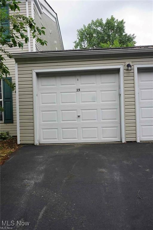 23 Valley Forge Ln, Elyria, OH 44035 - garage featuring asphalt driveway