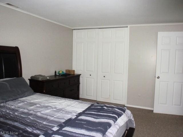 23 Valley Forge Ln, Elyria, OH 44035 - carpeted bedroom with a closet and ornamental molding