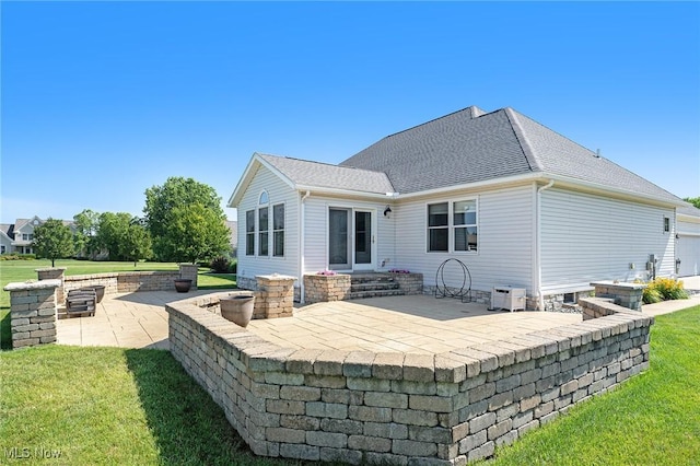 6782 Fawndale Dr, Medina, OH 44256 - back of property featuring a patio, a yard, and roof with shingles