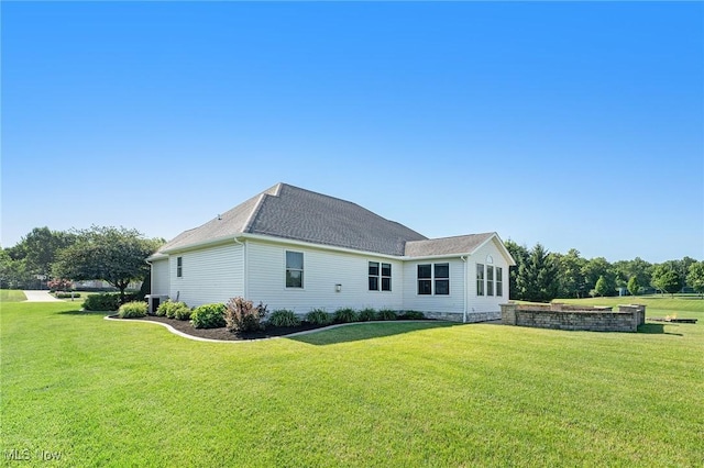 6782 Fawndale Dr, Medina, OH 44256 - rear view of house with a yard and a shingled roof