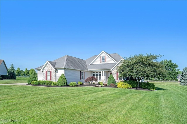6782 Fawndale Dr, Medina, OH 44256 - traditional-style house featuring a front lawn and stone siding