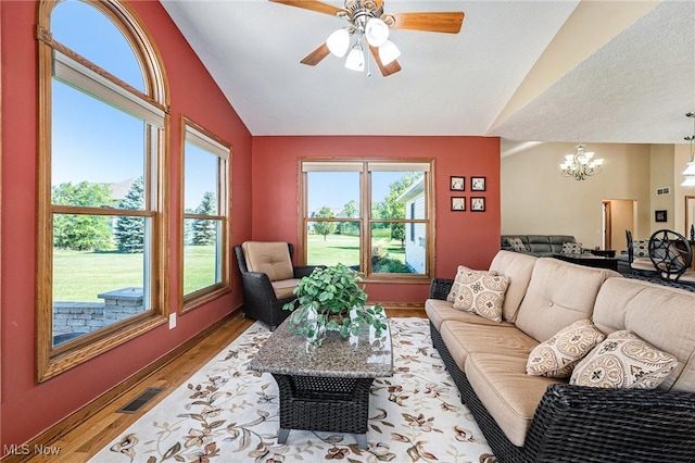 6782 Fawndale Dr, Medina, OH 44256 - living area with lofted ceiling, a chandelier, wood finished floors, and ceiling fan