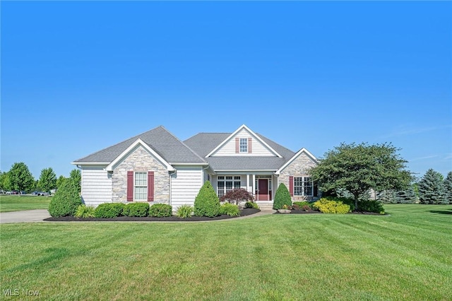 6782 Fawndale Dr, Medina, OH 44256 - view of front of property featuring stone siding, a front lawn, and covered porch