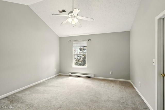 232 Damon Dr, Munroe Falls, OH 44262 - unfurnished room featuring a baseboard heating unit, a ceiling fan, carpet floors, vaulted ceiling, and a textured ceiling