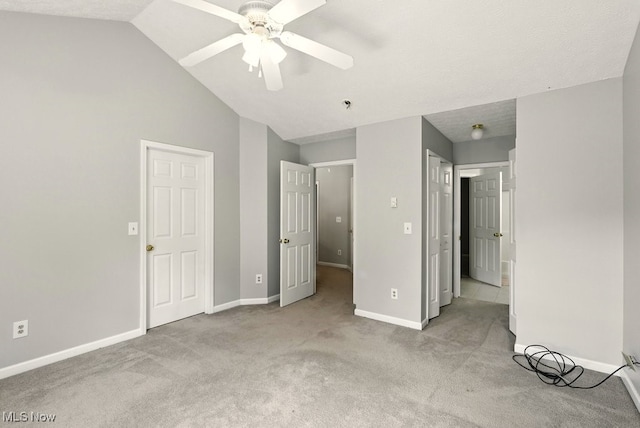 232 Damon Dr, Munroe Falls, OH 44262 - unfurnished bedroom with carpet flooring, vaulted ceiling, and a ceiling fan