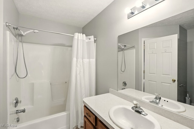 232 Damon Dr, Munroe Falls, OH 44262 - full bathroom with a textured ceiling, shower / bath combination with curtain, and vanity