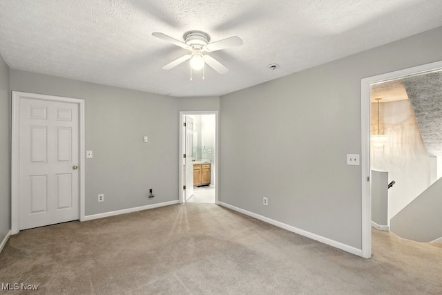 232 Damon Dr, Munroe Falls, OH 44262 - unfurnished bedroom featuring light colored carpet, ensuite bathroom, and a ceiling fan