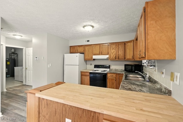 232 Damon Dr, Munroe Falls, OH 44262 - kitchen with white appliances, under cabinet range hood, electric water heater, light wood-style floors, and brown cabinetry