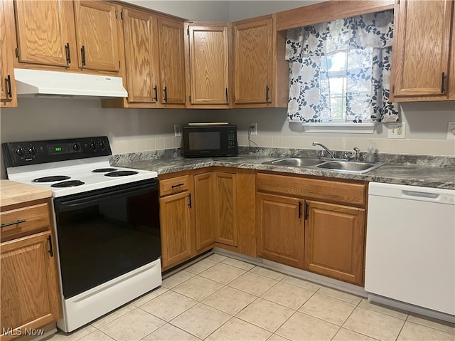 232 Damon Dr, Munroe Falls, OH 44262 - kitchen with electric range, black microwave, white dishwasher, under cabinet range hood, and light tile patterned floors