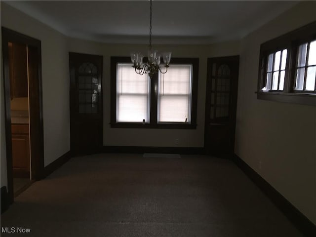 265 E 191st St, Euclid, OH 44119 - unfurnished dining area with a chandelier and carpet flooring
