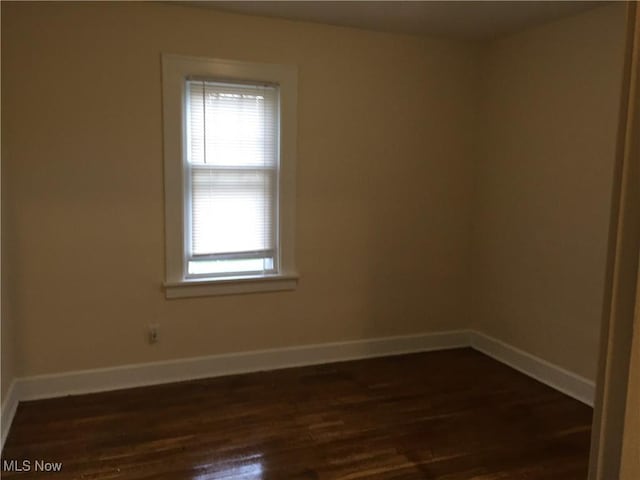 265 E 191st St, Euclid, OH 44119 - empty room with healthy amount of natural light and dark wood finished floors