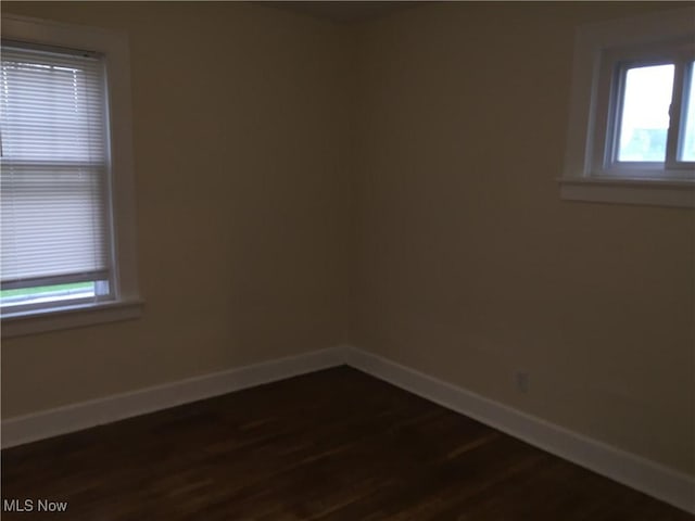 265 E 191st St, Euclid, OH 44119 - empty room featuring baseboards and dark wood finished floors