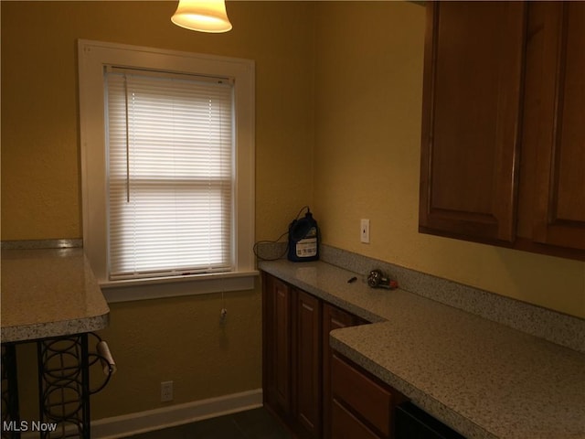 265 E 191st St, Euclid, OH 44119 - kitchen with light countertops and brown cabinets