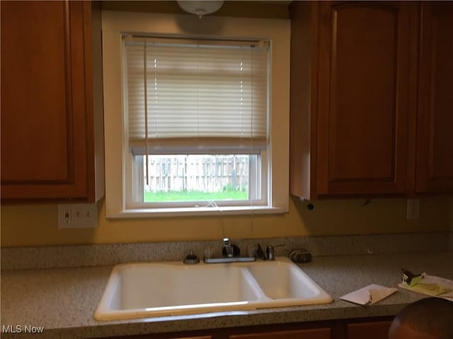 265 E 191st St, Euclid, OH 44119 - kitchen with light countertops and brown cabinets