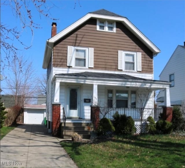 299 E 197th St, Euclid, OH 44119 - view of front of property with an outdoor structure, a chimney, a porch, a garage, and a front lawn