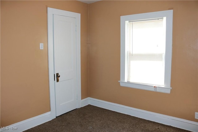 299 E 197th St, Euclid, OH 44119 - unfurnished room featuring dark colored carpet and baseboards