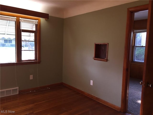 5785 Fitch Rd, North Olmsted, OH 44070 - spare room with dark wood-style floors and plenty of natural light
