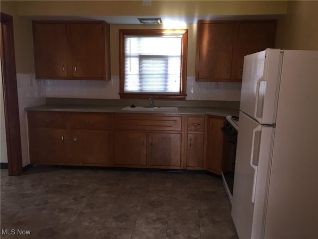 5785 Fitch Rd, North Olmsted, OH 44070 - kitchen with white appliances, brown cabinets, and backsplash