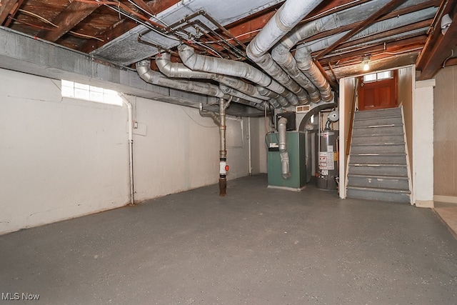 6207 Gerald Ave, Parma, OH 44129 - unfinished below grade area with gas water heater, stairway, and heating unit