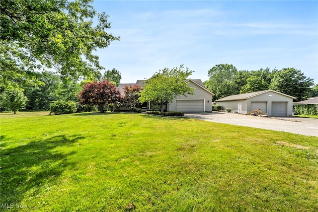 3578 County Line Rd, Madison, OH 44057 - view of property hidden behind natural elements featuring a front lawn and a garage