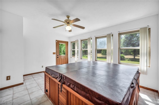 3578 County Line Rd, Madison, OH 44057 - kitchen featuring plenty of natural light, ceiling fan, light tile patterned floors, and dark countertops