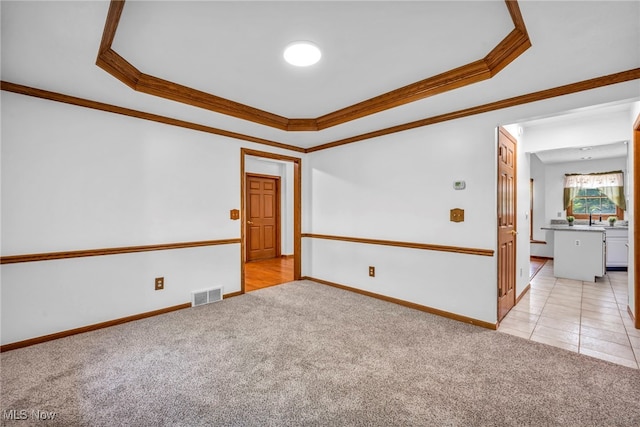 3578 County Line Rd, Madison, OH 44057 - unfurnished room with light colored carpet, ornamental molding, and a raised ceiling
